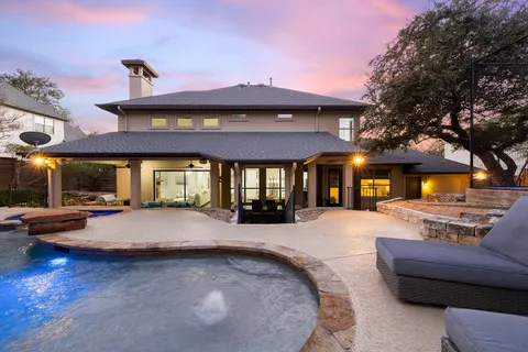 a view of a house with entertaining space and a patio