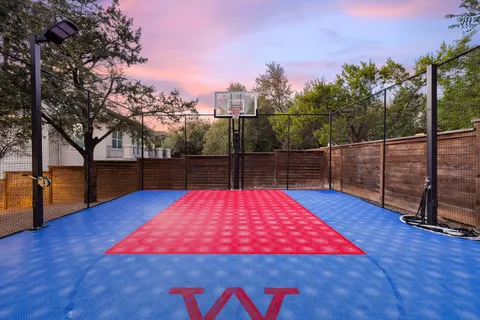 a view of outdoor space with pool and wooden floor