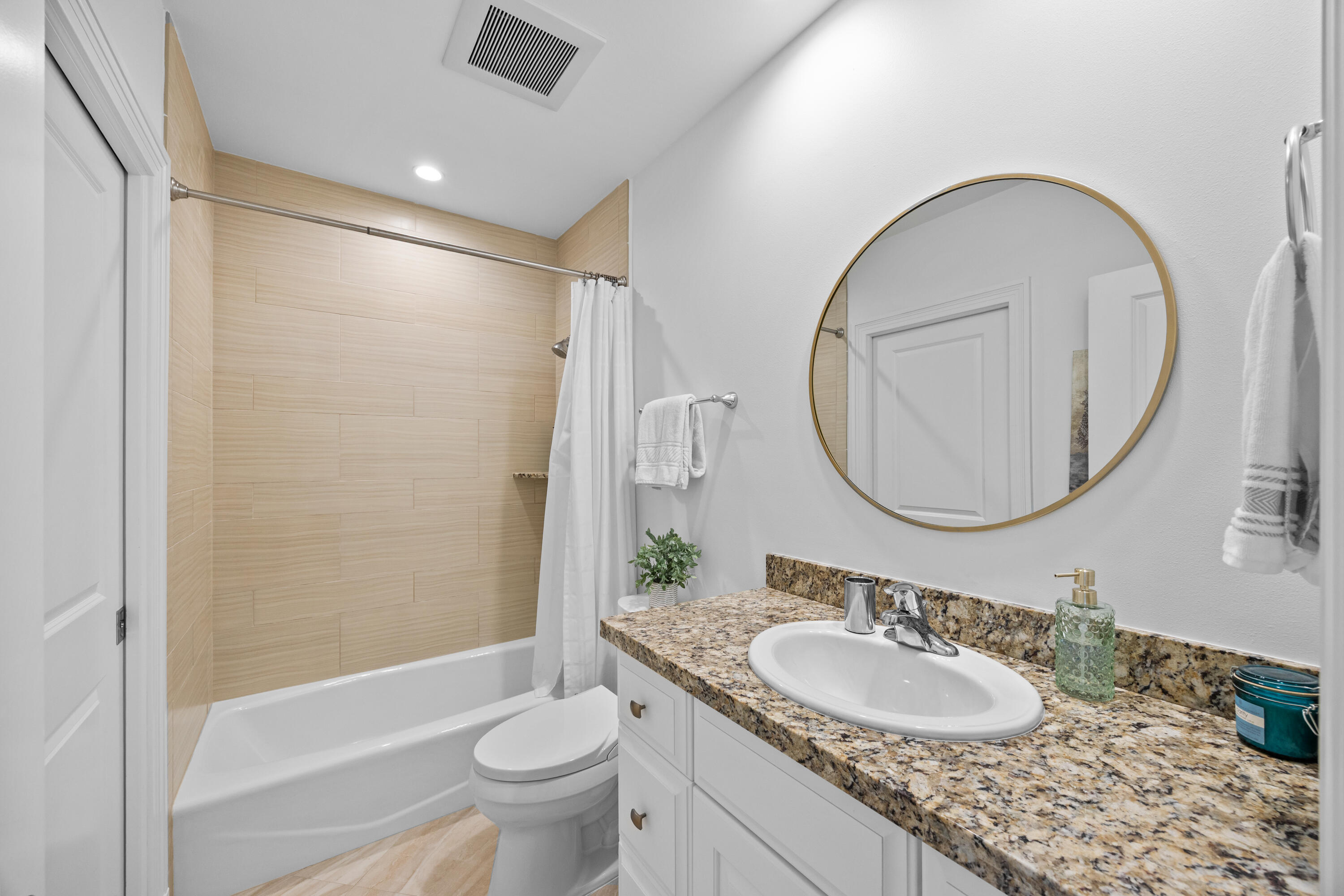 13254 Polo Club Road, Unit C204 Wellington, FL 33414 - Photo 16 of 29 a bathroom with a granite countertop sink toilet and a mirror
