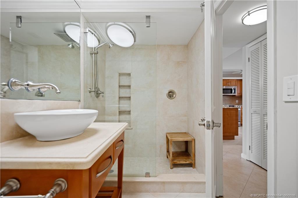 1866 Southwest Palm City Road, Unit 204 Stuart, FL 34994 - Photo 27 of 38 a bathroom with a sink and a mirror