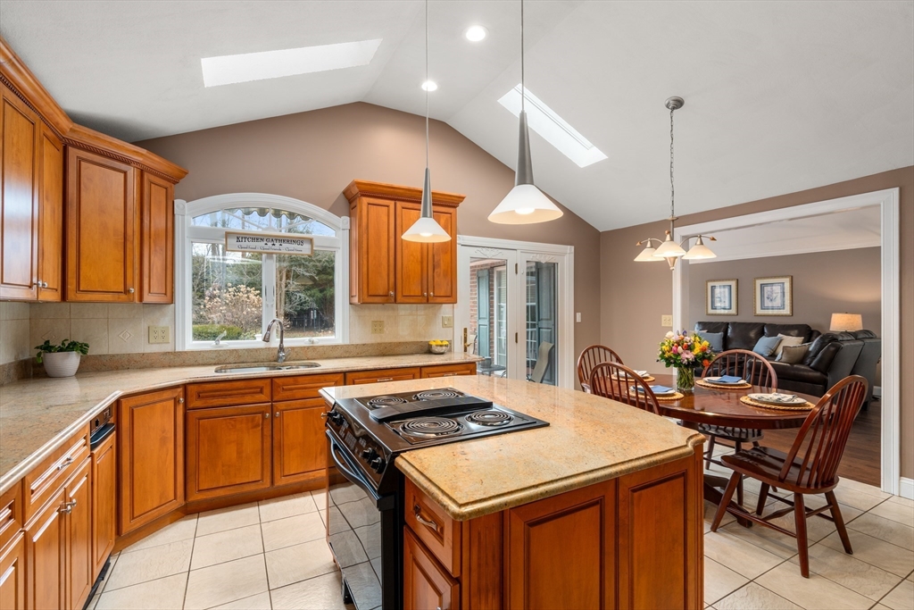 50 Stock Farm Road Sudbury, MA 01776 - Photo 12 of 40 a kitchen that has a stove a table and chairs in it