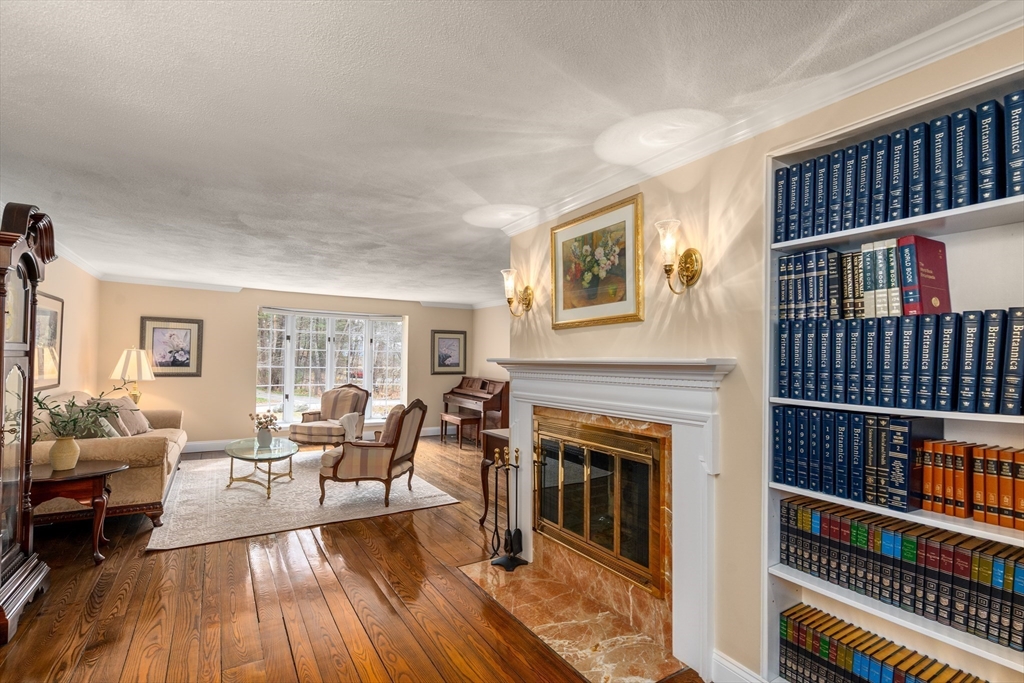 50 Stock Farm Road Sudbury, MA 01776 - Photo 16 of 40 a living room with furniture fireplace and rug