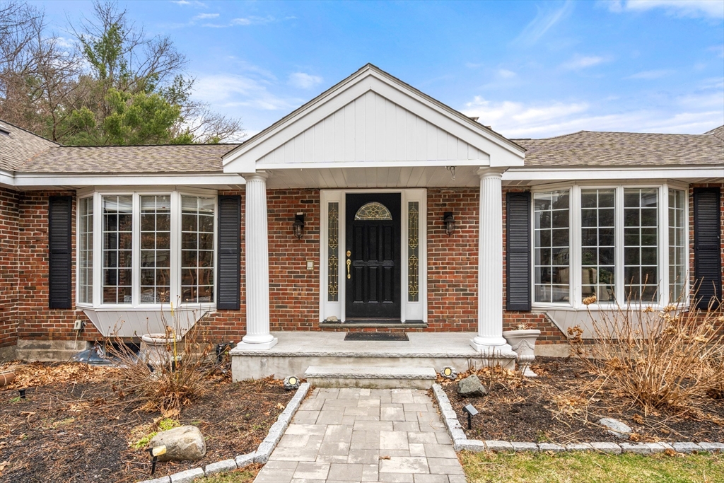 50 Stock Farm Road Sudbury, MA 01776 - Photo 2 of 40 a front view of a house with a garden