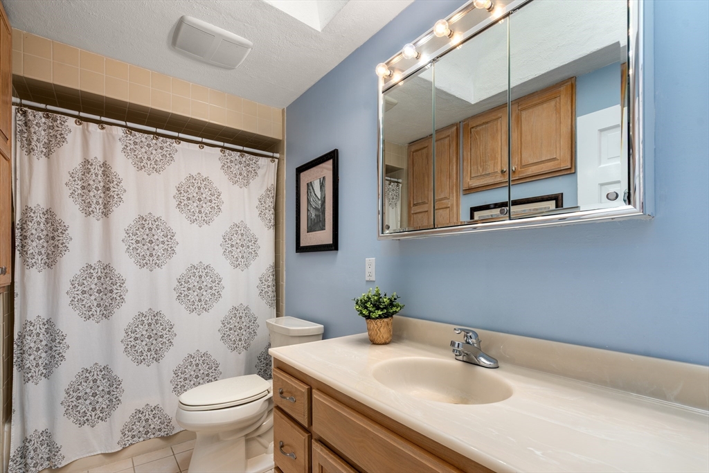 50 Stock Farm Road Sudbury, MA 01776 - Photo 24 of 40 a bathroom with a sink toilet and shower