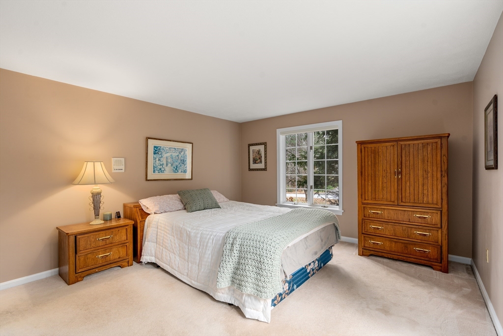 50 Stock Farm Road Sudbury, MA 01776 - Photo 25 of 40 a bedroom with a bed and a window