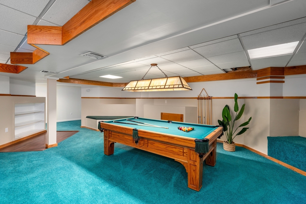 50 Stock Farm Road Sudbury, MA 01776 - Photo 27 of 40 a backyard with a table and chairs