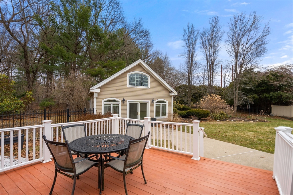 50 Stock Farm Road Sudbury, MA 01776 - Photo 29 of 40 a view of a house with a deck and a yard