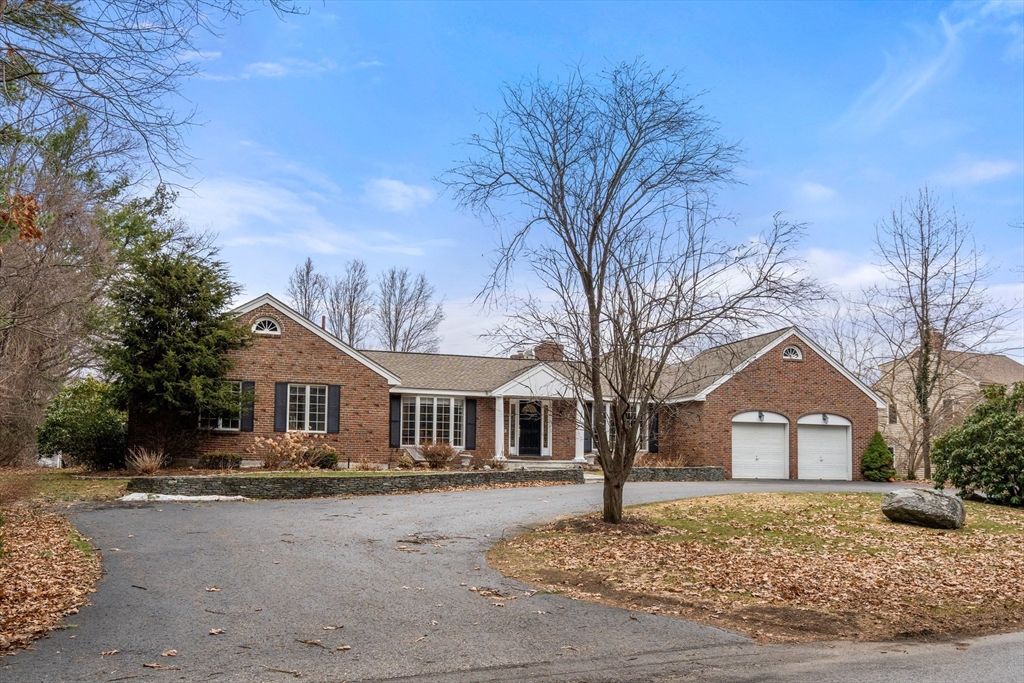 50 Stock Farm Road Sudbury, MA 01776 - Photo 3 of 40 a front view of a house with a yard