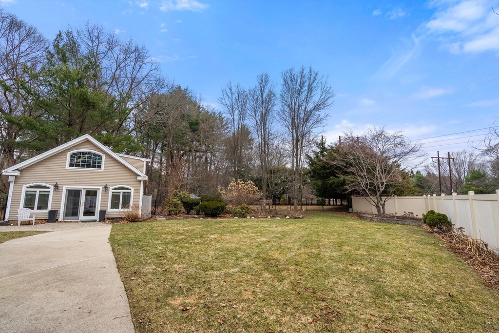 50 Stock Farm Road Sudbury, MA 01776 - Photo 31 of 40 a view of a house with a yard