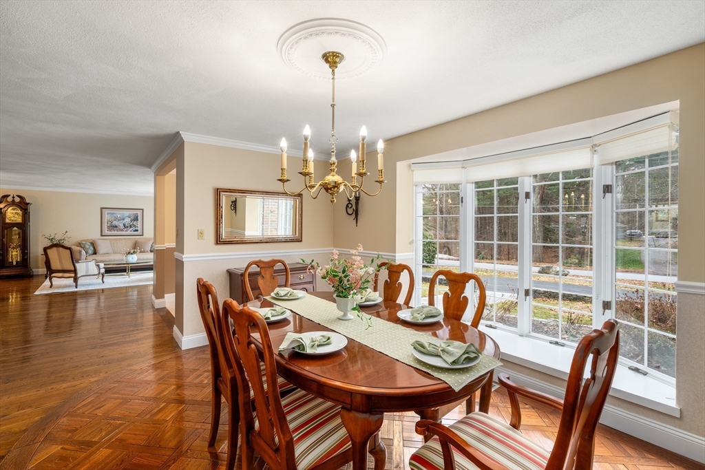 50 Stock Farm Road Sudbury, MA 01776 - Photo 9 of 40 a view of a dining room with furniture window and wooden floor