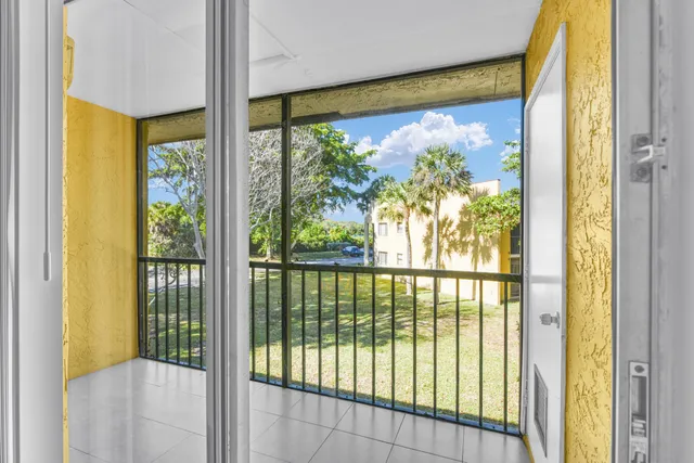 a view of a porch with a large window