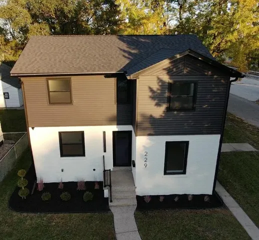 a aerial view of a house with a yard