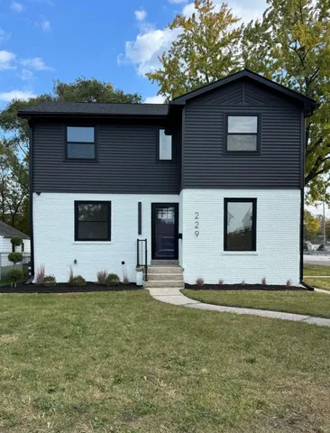a house with yard in front of it