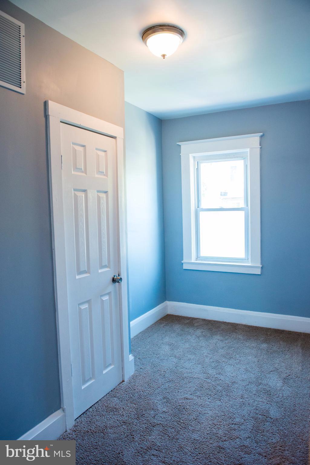764 Edgewood Street Baltimore, MD 21229 - Photo 13 of 25 an empty room with windows