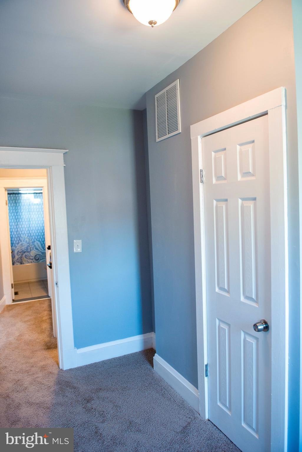 764 Edgewood Street Baltimore, MD 21229 - Photo 14 of 25 an empty room with mirror