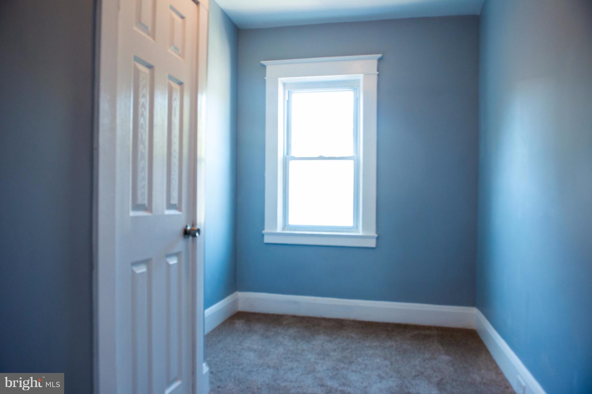 764 Edgewood Street Baltimore, MD 21229 - Photo 16 of 25 an empty room with a window