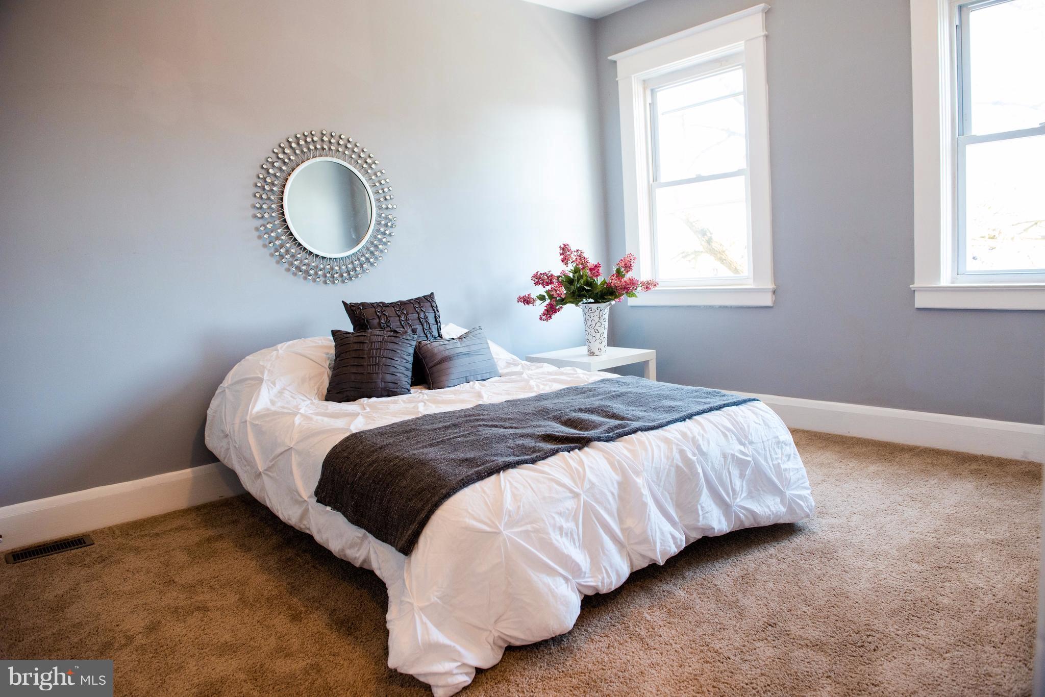 764 Edgewood Street Baltimore, MD 21229 - Photo 21 of 25 a bedroom with bed and a window