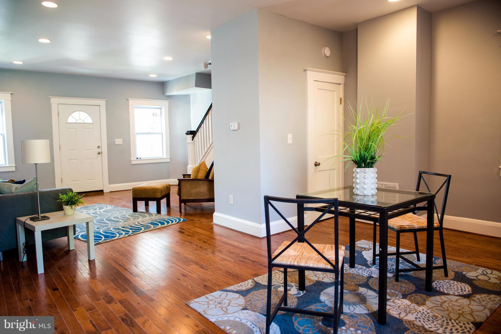 764 Edgewood Street Baltimore, MD 21229 - Photo 8 of 25 a workspace with furniture and wooden floor