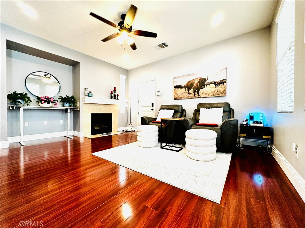 31891 Domenoe Way Temecula, CA 92592 - Photo 5 of 36 First floor living room with fireplace