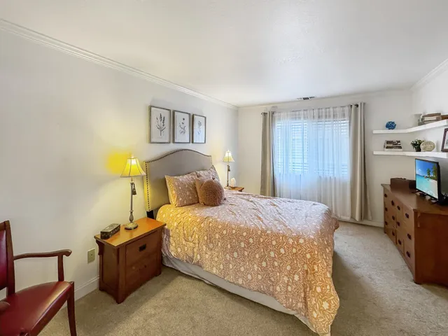 a bedroom with a bed and furniture