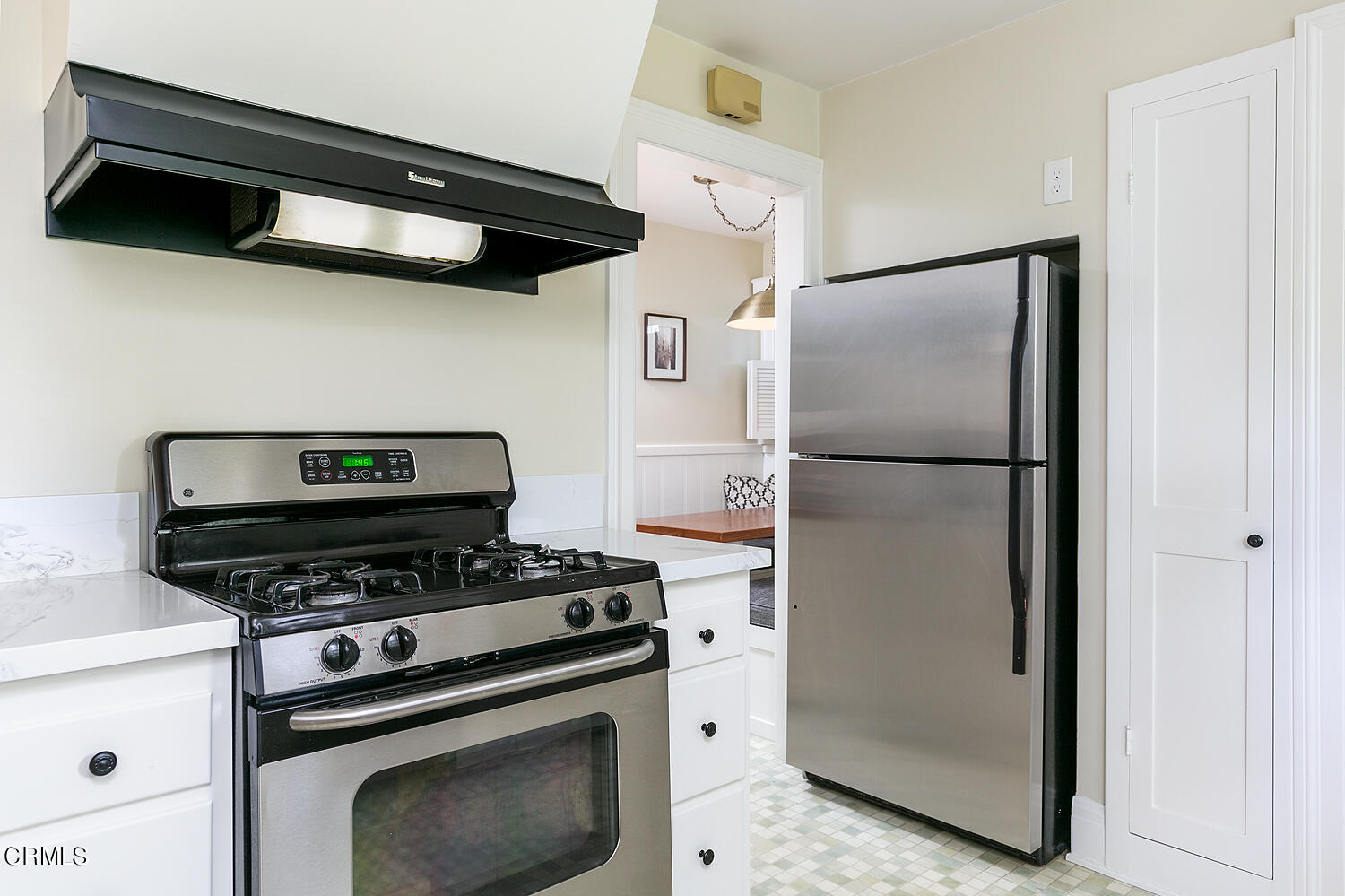 150 Club Road Pasadena, CA 91105 - Photo 10 of 24 a kitchen with stainless steel appliances a refrigerator a stove and a cabinets