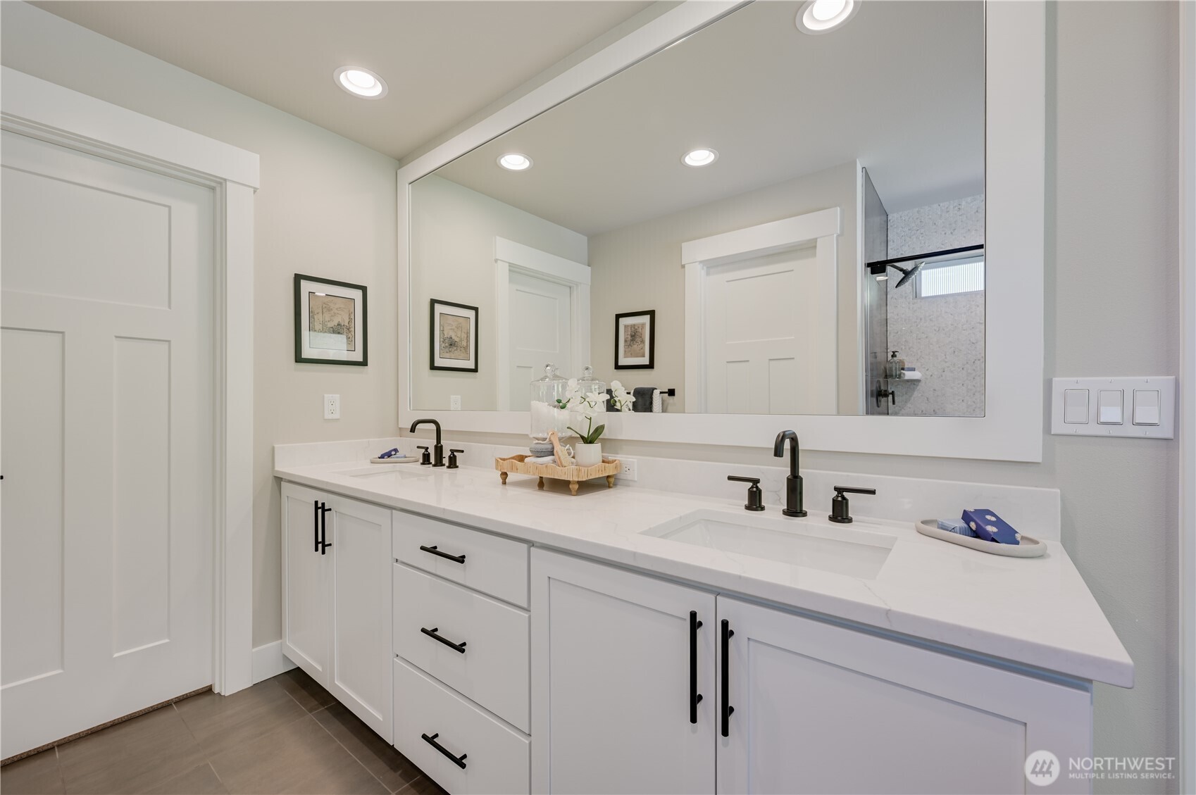 19231 Meridian Drive Southeast, Unit CW 13 Bothell, WA 98012 - Photo 30 of 36 a bathroom with a double vanity sink and a mirror