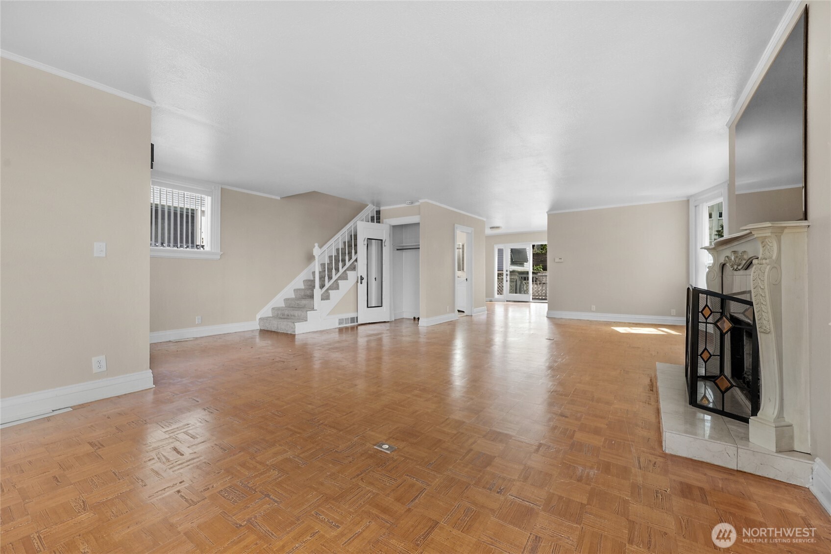 924 3rd Avenue West Seattle, WA 98119 - Photo 7 of 18 a view of a livingroom with wooden floor and a fireplace