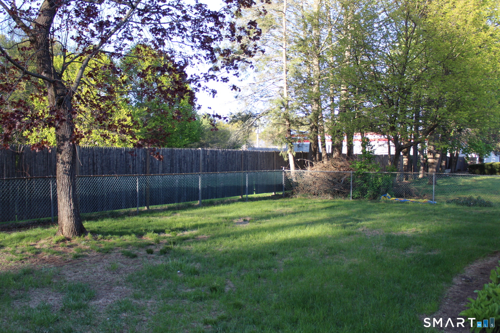 18 Walsh Street Bloomfield, CT 06002 - Photo 14 of 14 a garden with wooden fence