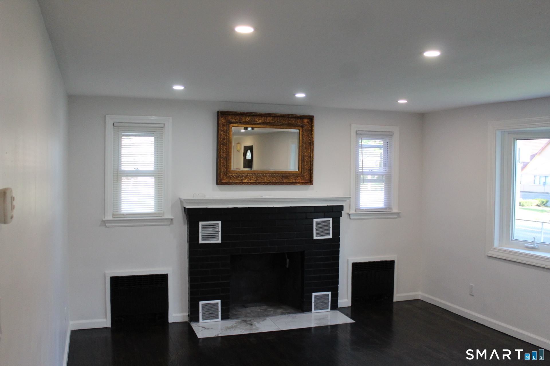18 Walsh Street Bloomfield, CT 06002 - Photo 6 of 14 a living room with fireplace