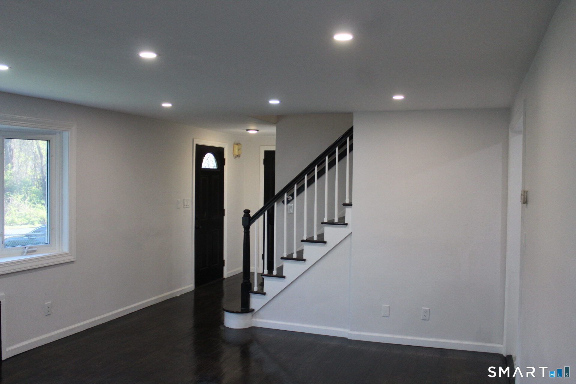18 Walsh Street Bloomfield, CT 06002 - Photo 7 of 14 an entryway in a hall with a window