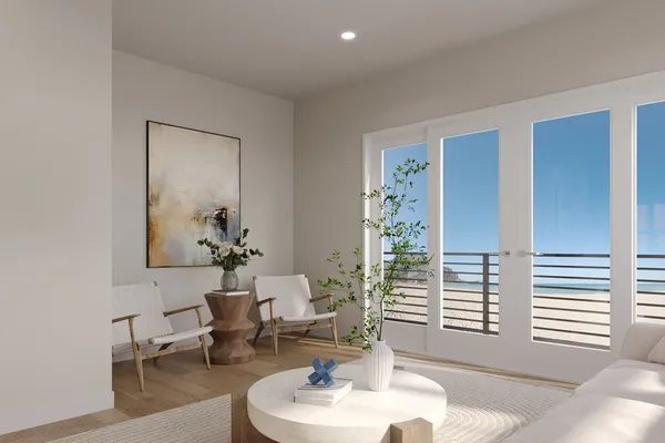 a living room with furniture and a potted plant