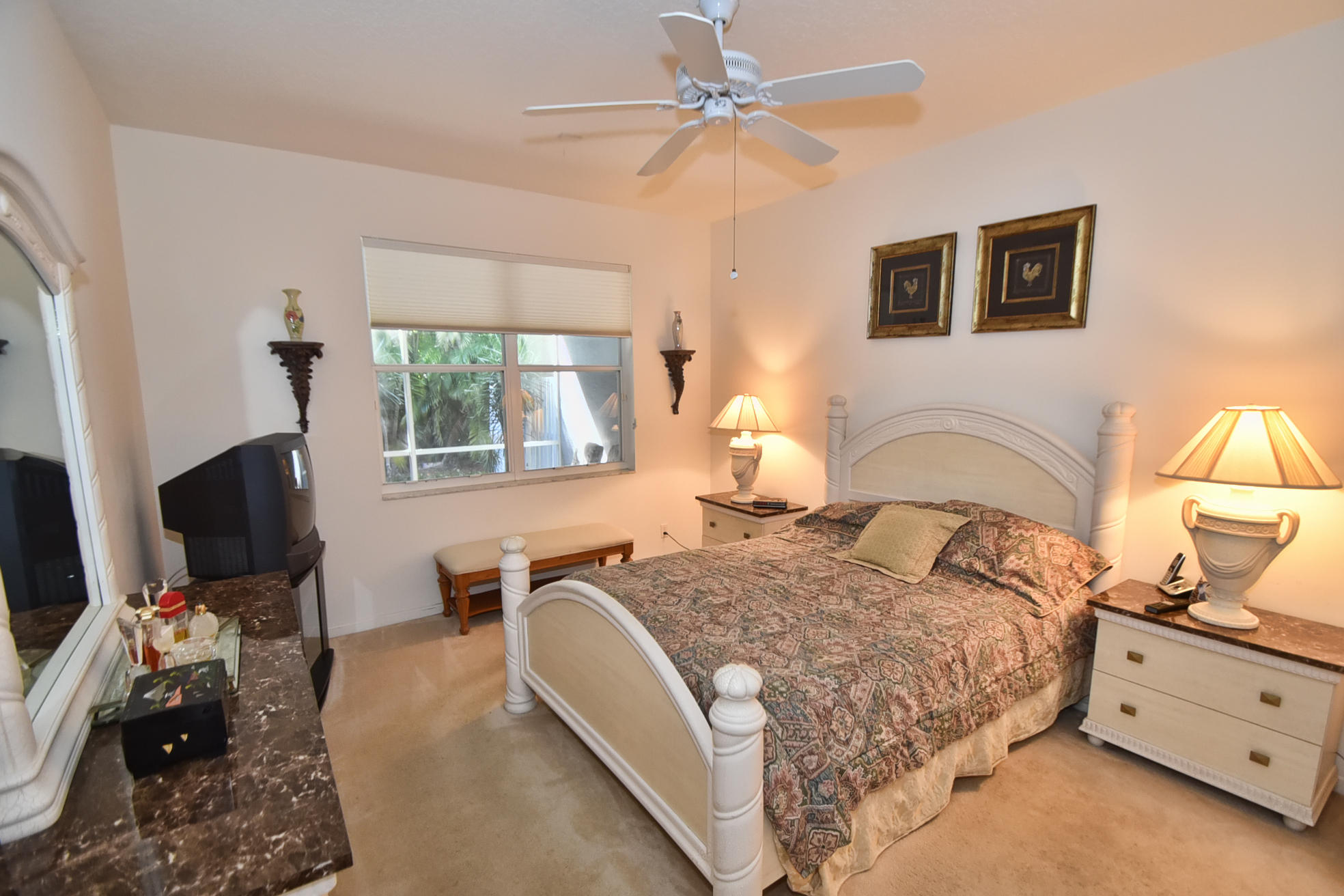 5916 Seashell Terrace Boynton Beach, FL 33437 - Photo 14 of 31 a bedroom with a bed and a flat screen tv