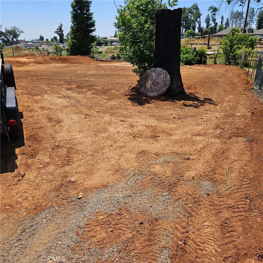 5415 Sawmill Road Paradise, CA 95969 - Photo 1 of 1 a street view with garden space and trees