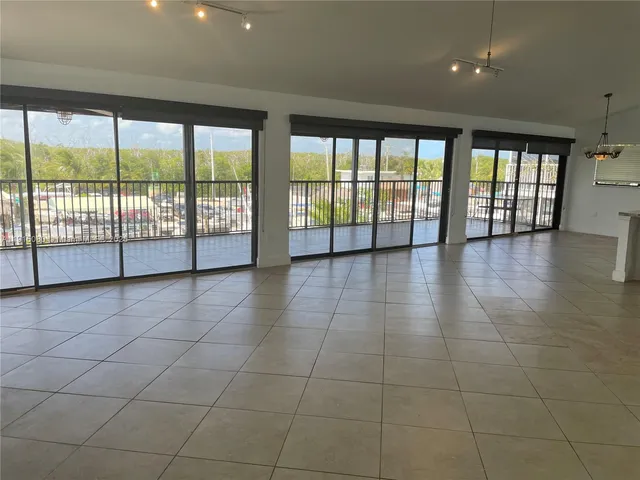 a view of an empty room with a large window