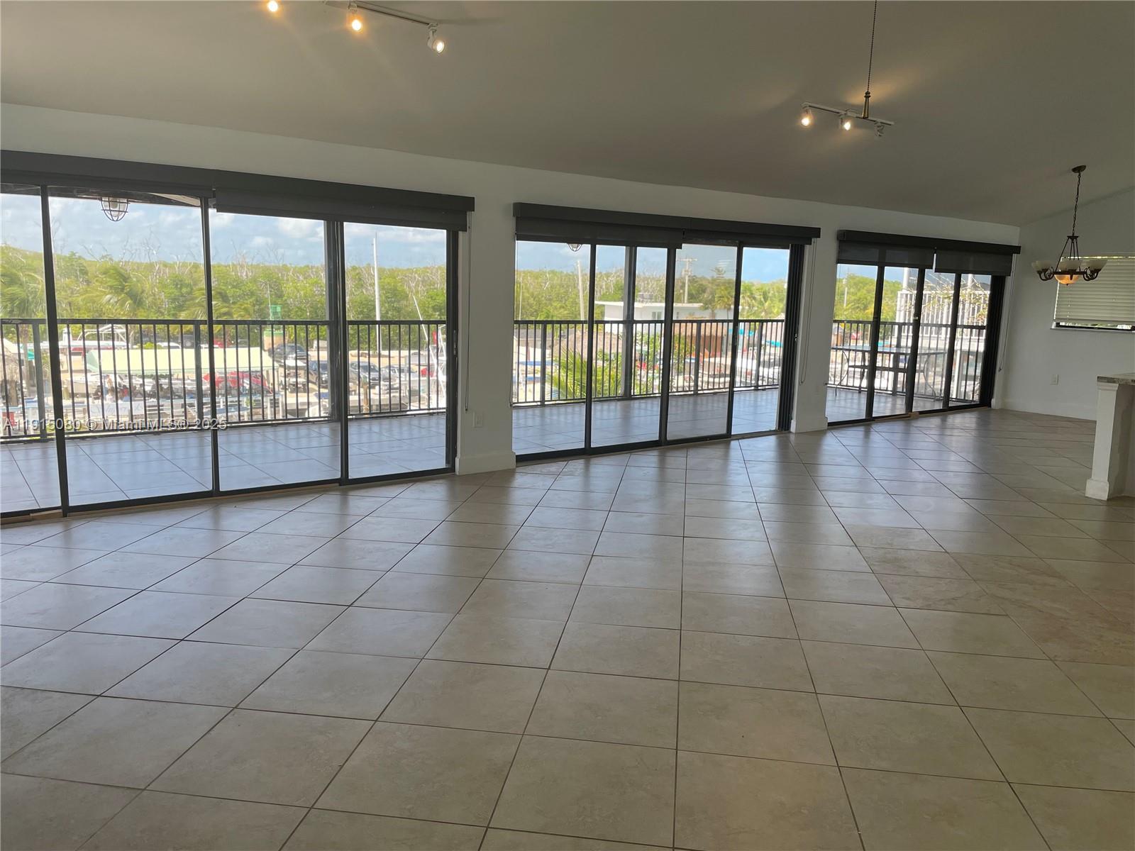 26 South Exuma Road, Unit B Key Largo, FL 33037 - Photo 2 of 6 a view of an empty room with a large window