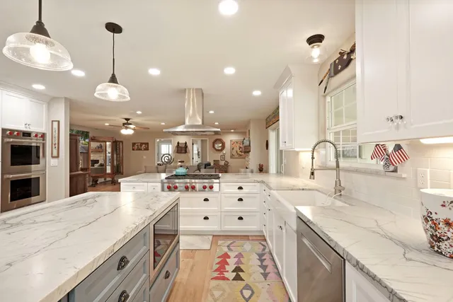 a kitchen with a sink stove and cabinets