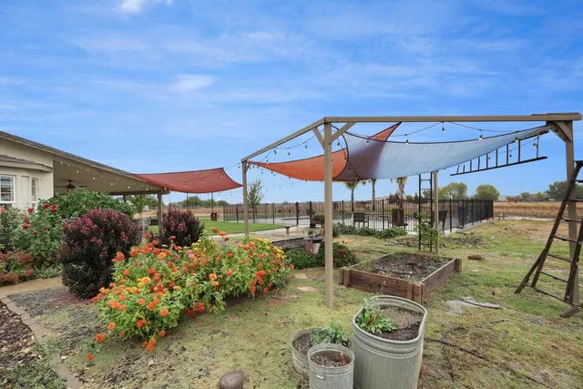 an aerial view of a swimming pool and mountain