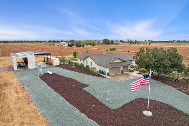 an aerial view of a houses with outdoor space