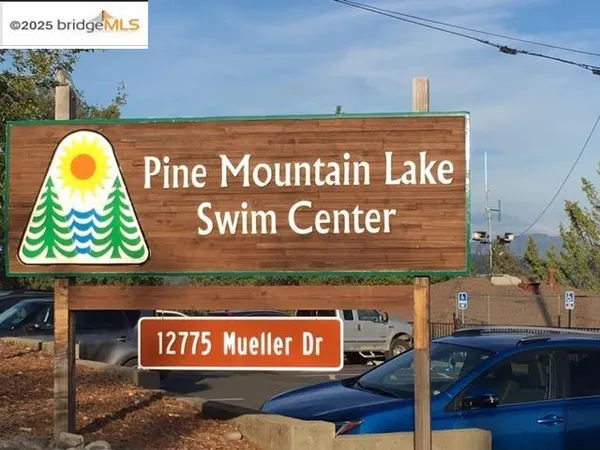 a view of swimming pool with a patio