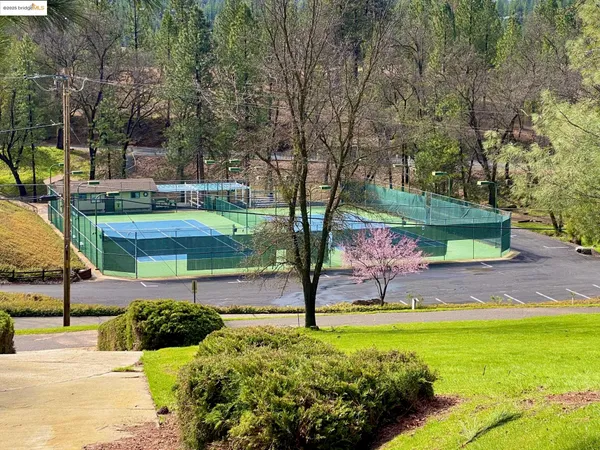 a view of outdoor space with a sign board