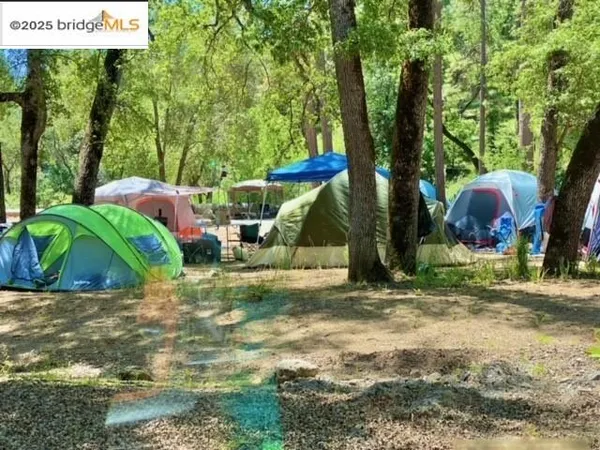 a view of a wooden deck and a lake view