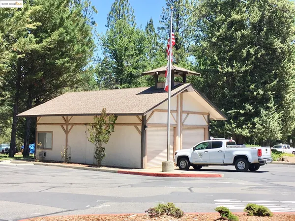 a view of swimming pool with a wooden fence