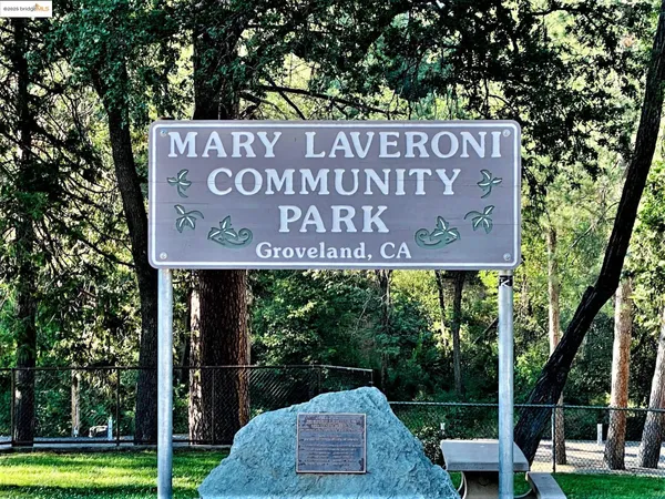 a view of outdoor space with signage and flags