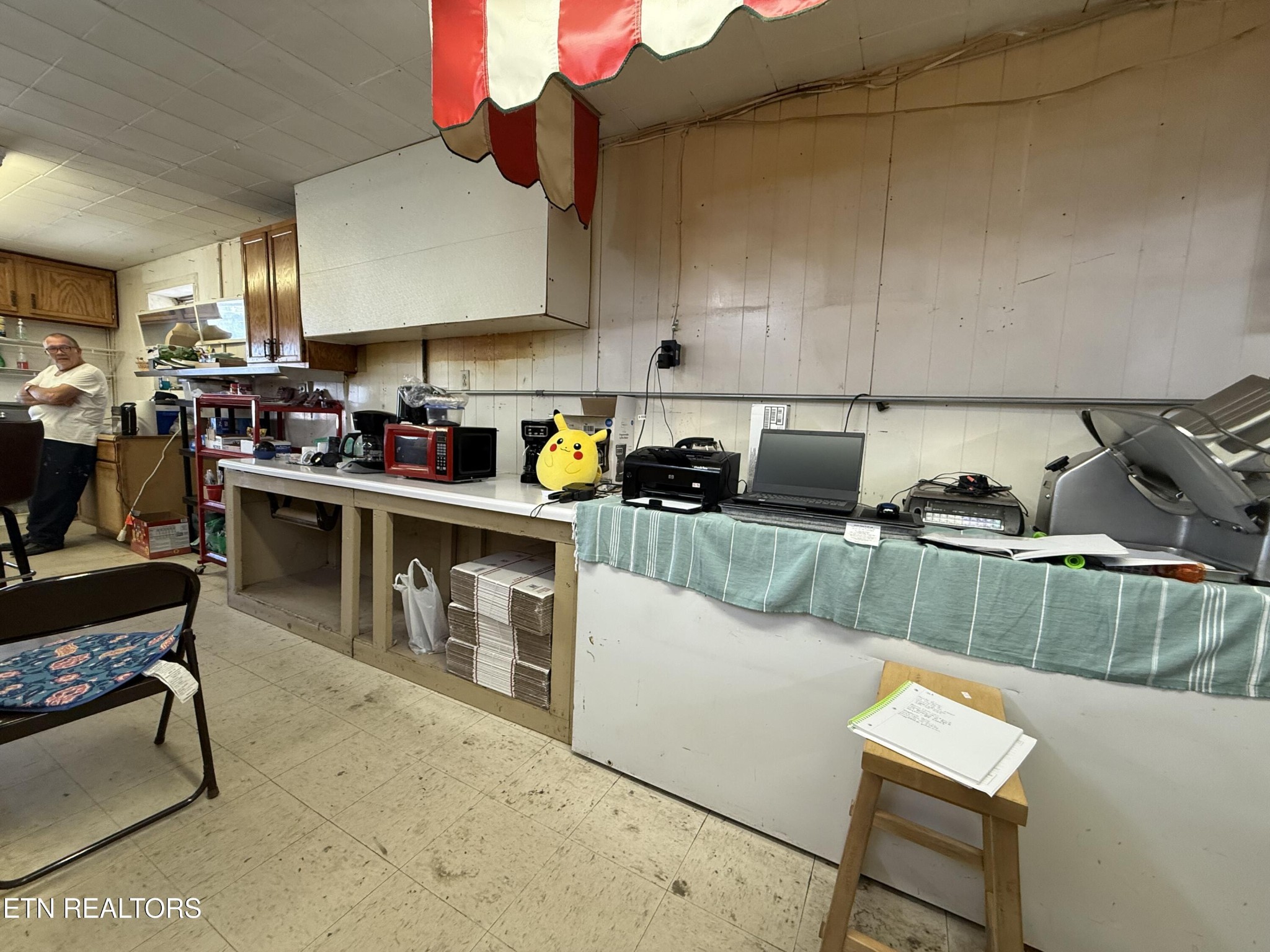 610 Paint Rock Road Oneida, TN 37841 - Photo 18 of 32 a kitchen with stainless steel appliances granite countertop a sink a stove top oven a counter space and cabinets