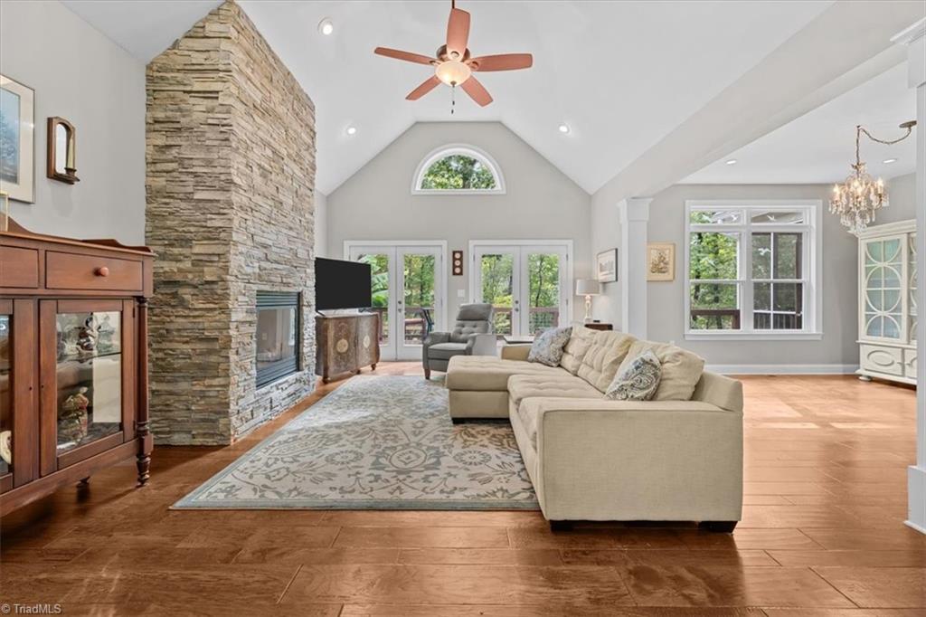 7355 Pisgah Covered Bridge Road Asheboro, NC 27205 - Photo 5 of 50 Living room with stone gas fireplace and abundant natural light