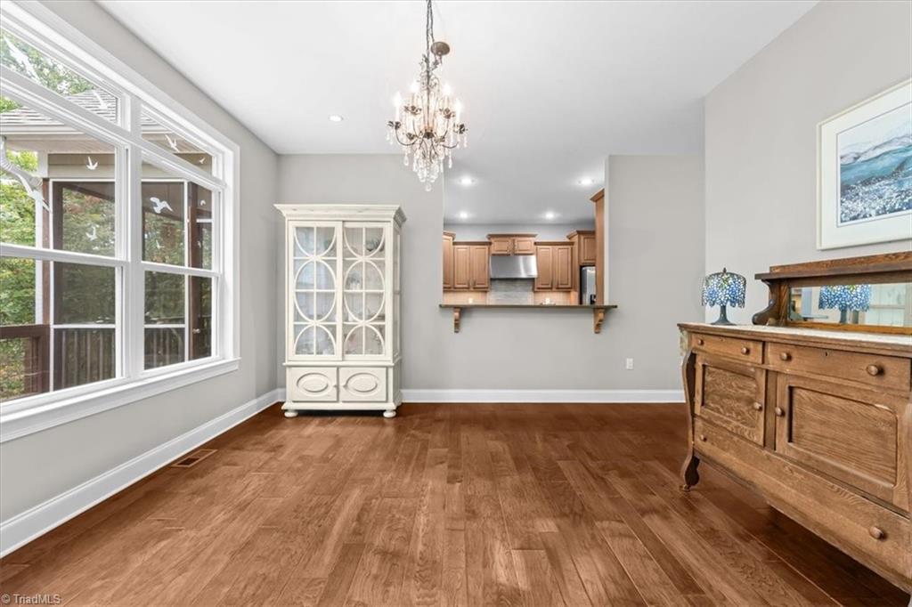 7355 Pisgah Covered Bridge Road Asheboro, NC 27205 - Photo 10 of 50 Dining room also features natural light and a serving window from the chef's kitchen