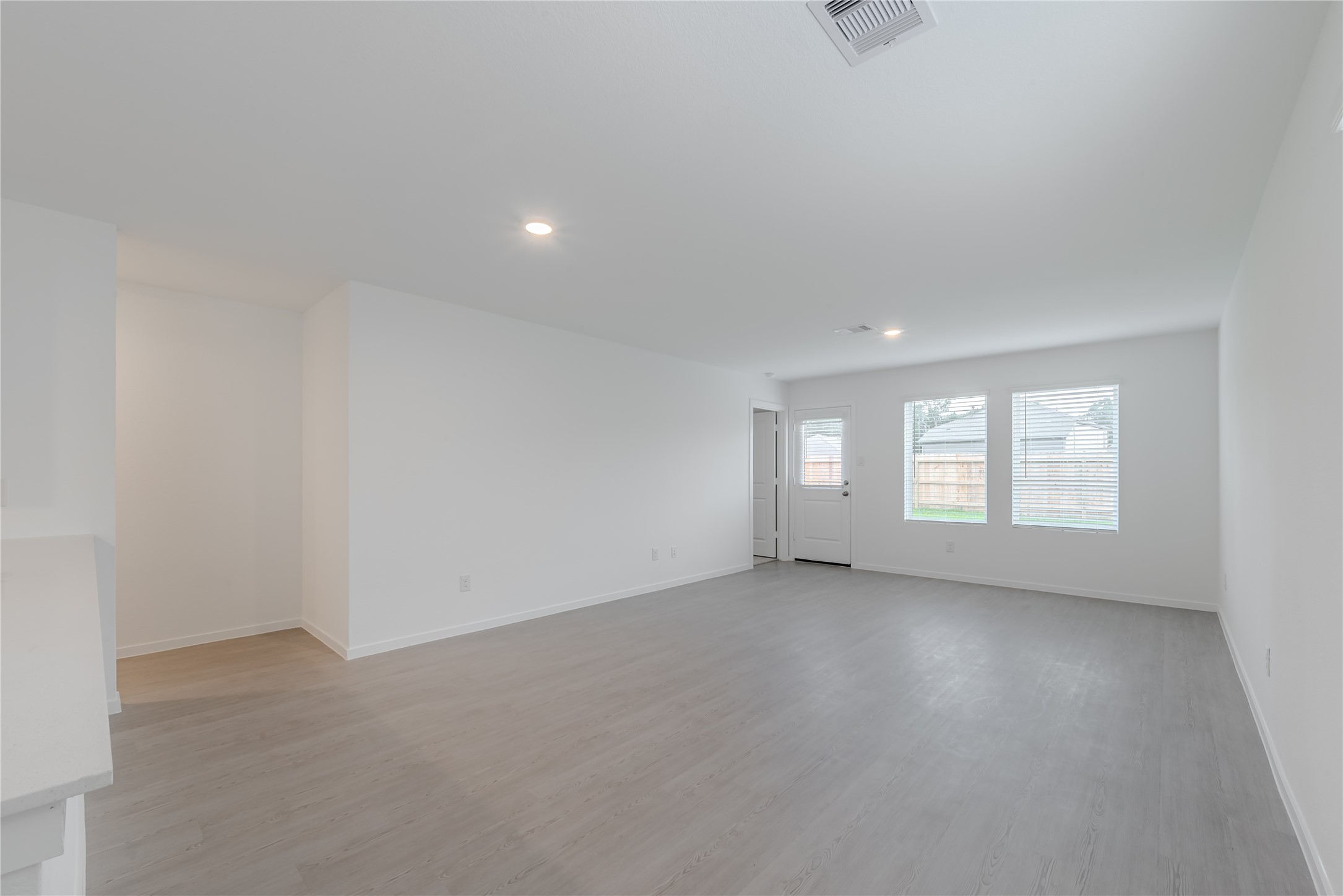 21358 Offida Lane New Caney, TX 77357 - Photo 11 of 26 an empty room with windows and entrance