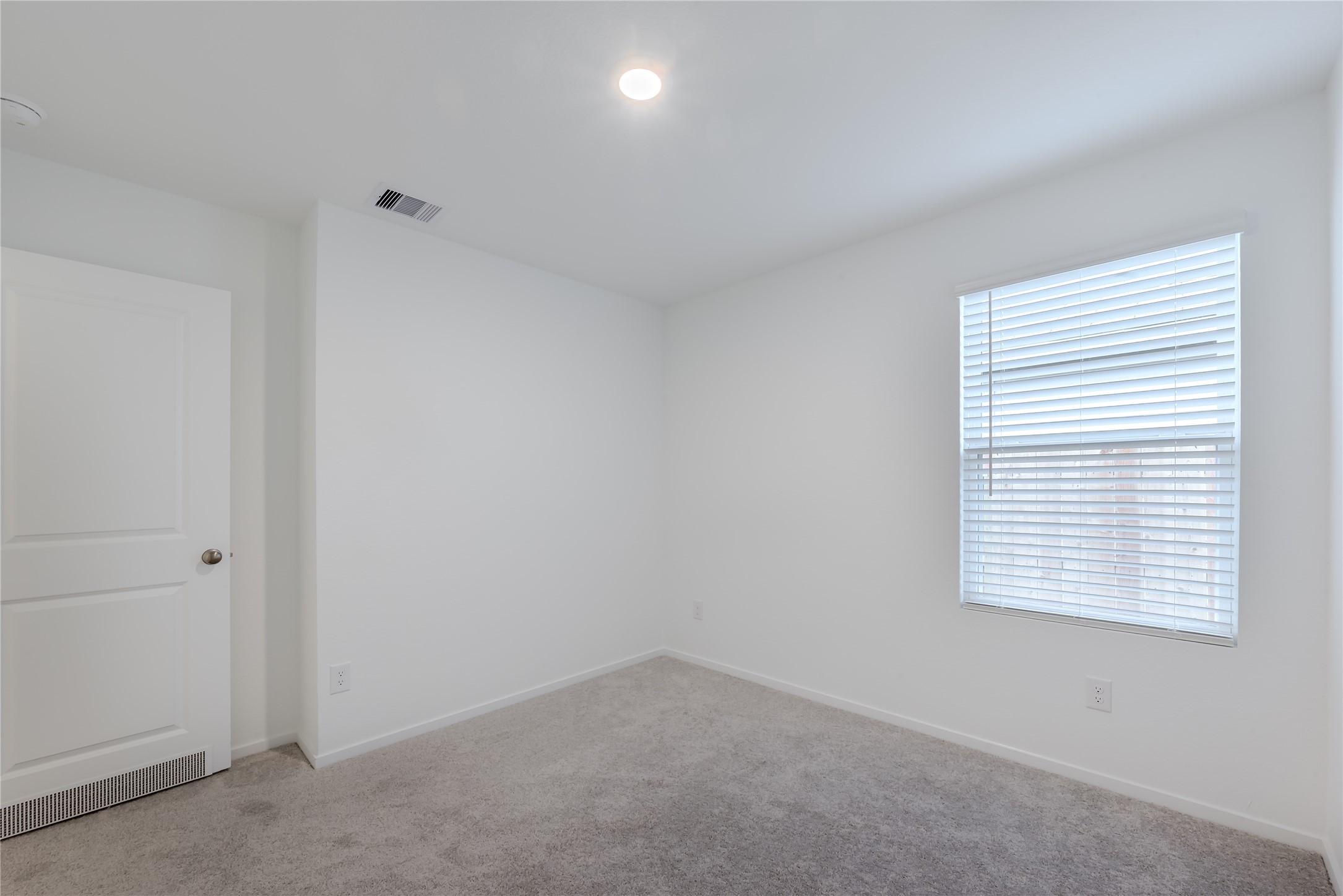 21358 Offida Lane New Caney, TX 77357 - Photo 19 of 26 an empty room with a window