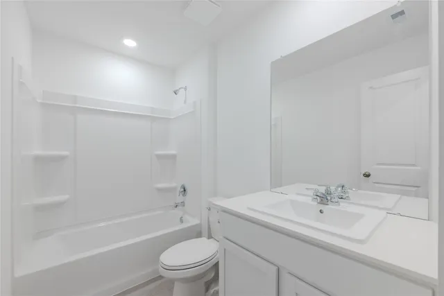 a bathroom with a sink a toilet and a bathtub