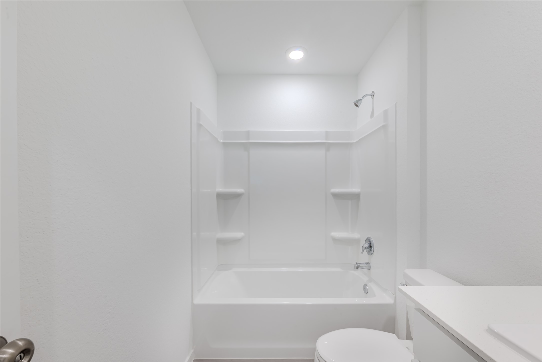 21358 Offida Lane New Caney, TX 77357 - Photo 22 of 26 a bathroom with a bathtub and a toilet